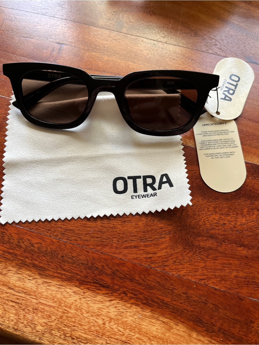 New otra eyewear black sunglasses women’s angular design